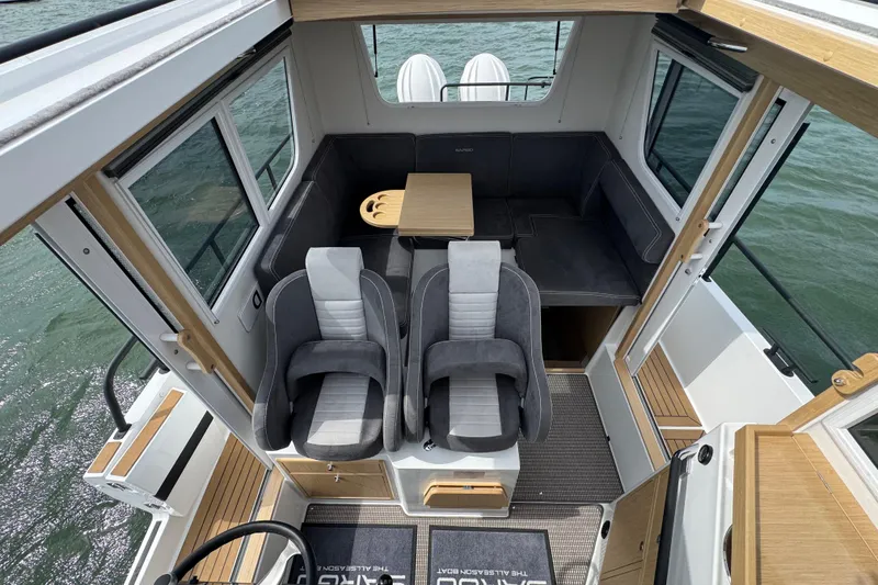 Slide: The Image of Interior of Sargo 28 boat, 2025 model, featuring modern seating and table. - 12