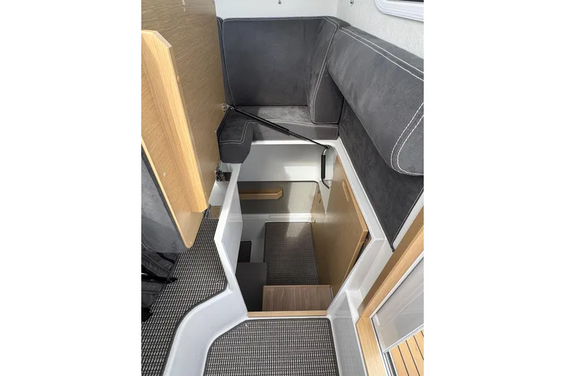 Slide: The Image of Interior of 2025 Sargo 28 boat, featuring modern seating and compact design. - 23