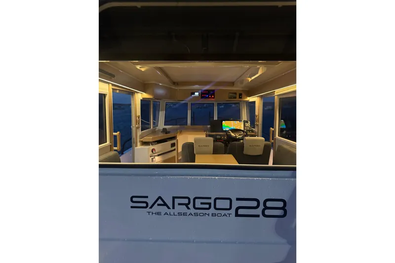 Slide: The Image of Interior view of Sargo 28 boat, model year 2025, at dusk. - 7