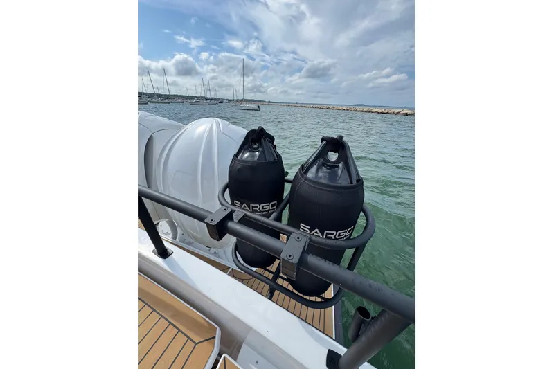 Slide: The Image of Sargo 28 boat 2025 with fenders on calm water. - 8
