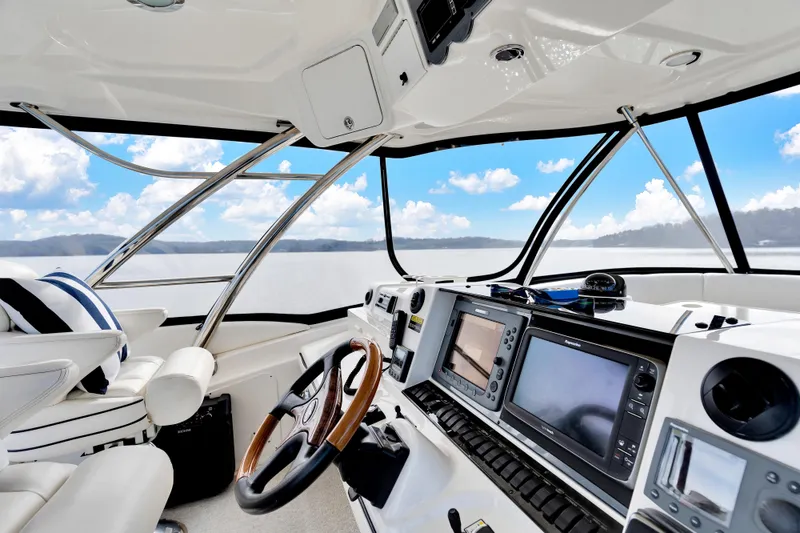 Slide: The Image of Interior of 2006 Sea Ray 58 Sedan Bridge yacht with modern navigation equipment. - 13