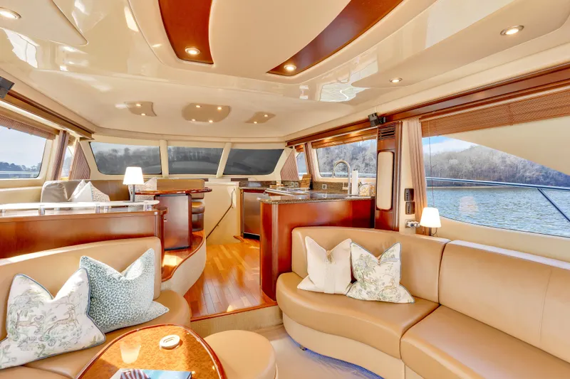 Slide: The Image of Luxurious interior of 2006 Sea Ray 58 Sedan Bridge yacht with elegant seating and panoramic windows. - 19