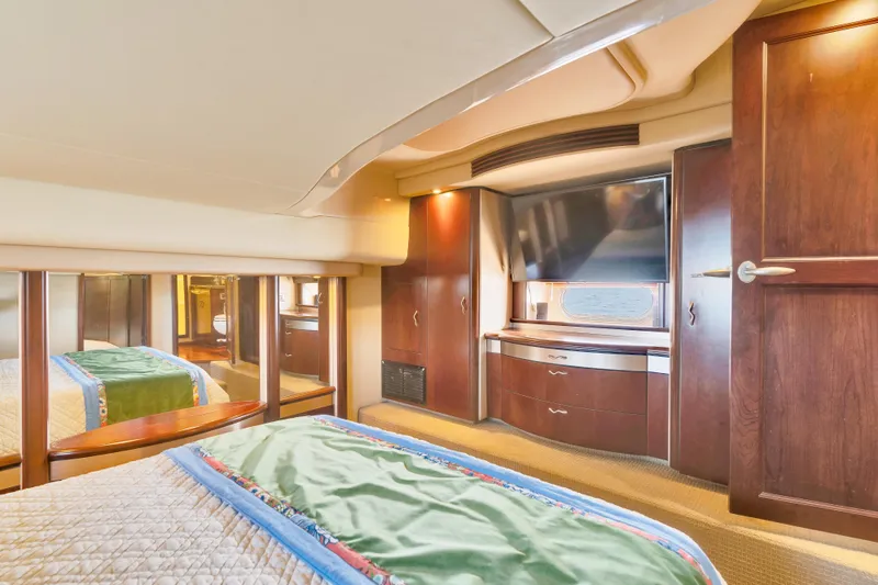 Slide: The Image of Luxurious cabin interior of 2006 Sea Ray 58 Sedan Bridge yacht with elegant wood finishes. - 29