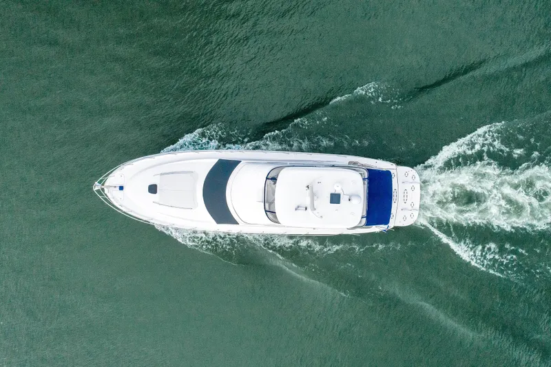 Slide: The Image of Aerial view of 2006 Sea Ray 58 Sedan Bridge yacht cruising on water. - 3
