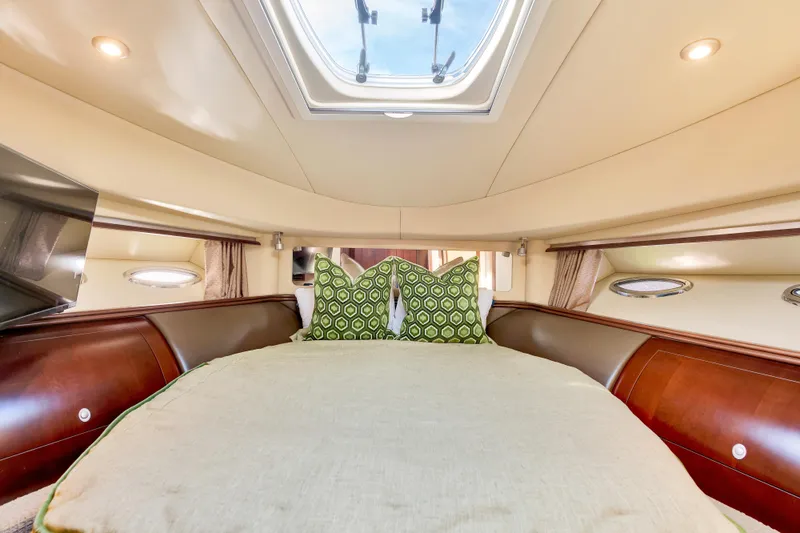 Slide: The Image of Luxurious cabin interior of 2006 Sea Ray 58 Sedan Bridge yacht with skylight and elegant bedding. - 30