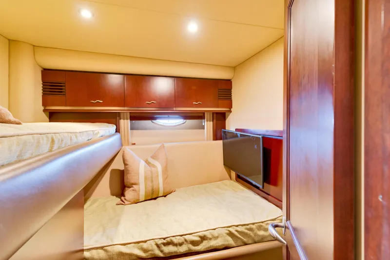 Slide: The Image of Luxurious cabin interior of 2006 Sea Ray 58 Sedan Bridge yacht with cozy bedding. - 31
