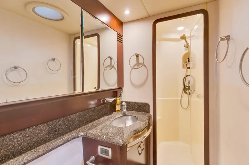 Slide: The Image of Luxurious bathroom in 2006 Sea Ray 58 Sedan Bridge yacht with modern fixtures. - 33