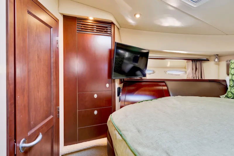 Slide: The Image of Luxurious 2006 Sea Ray 58 Sedan Bridge cabin with elegant wood finishes and modern amenities. - 35