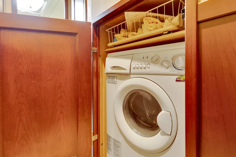 Slide: The Image of Laundry area with washing machine inside 2006 Sea Ray 58 Sedan Bridge yacht. - 38