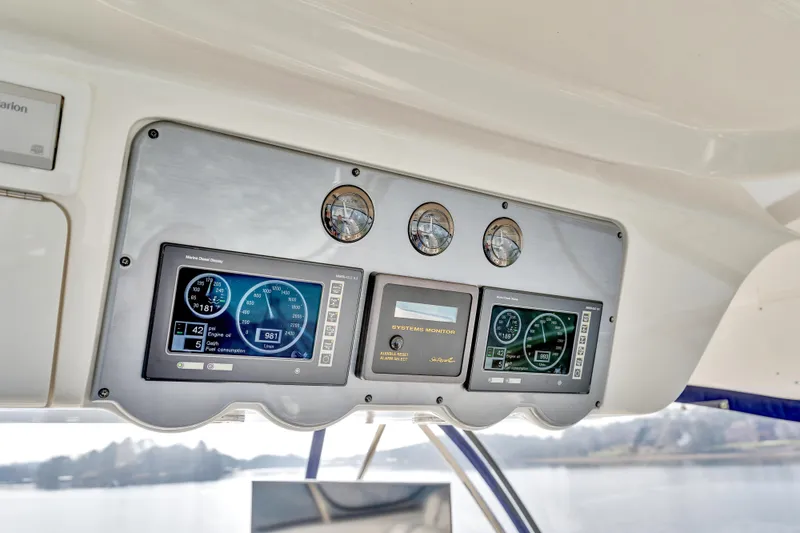 Slide: The Image of Control panel of 2006 Sea Ray 58 Sedan Bridge yacht with digital displays. - 39
