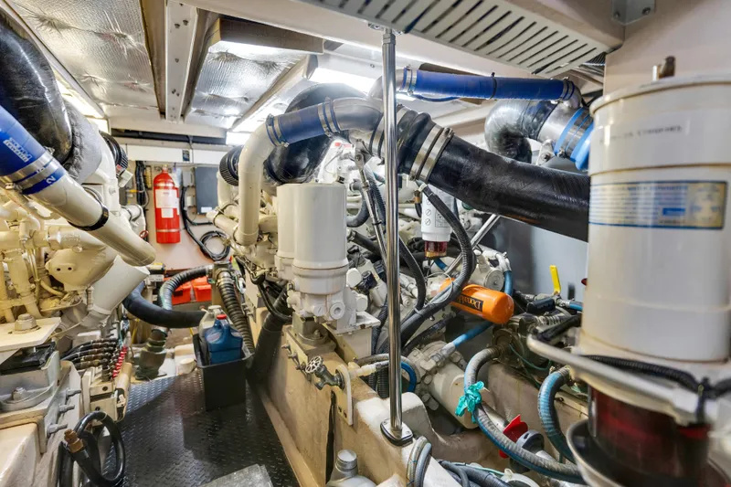 Slide: The Image of Engine room of 2006 Sea Ray 58 Sedan Bridge, showcasing complex machinery and components. - 43