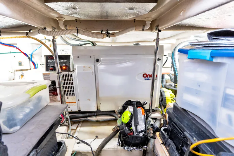 Slide: The Image of Engine room of 2006 Sea Ray 58 Sedan Bridge with Onan marine generator. - 45