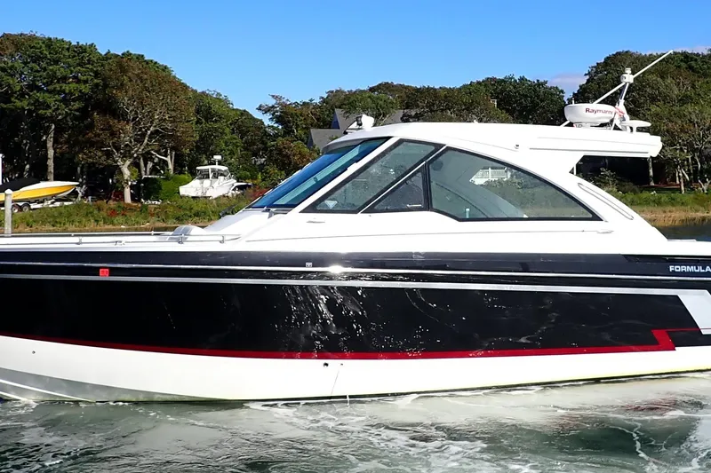 The Image of 2022 Formula 380 Super Sport Crossover OB boat cruising on water. - 0