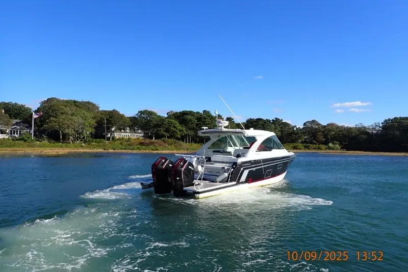 Slide: The Image of Interior view of 2022 Formula 380 Super Sport Crossover OB, featuring cozy seating area. - 11