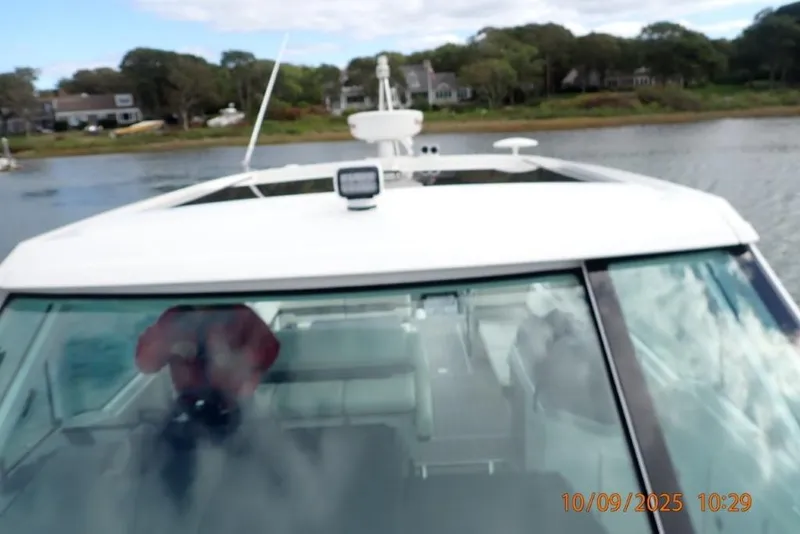 Slide: The Image of 2022 Formula 380 Super Sport Crossover OB interior with white seating and gray flooring. - 23