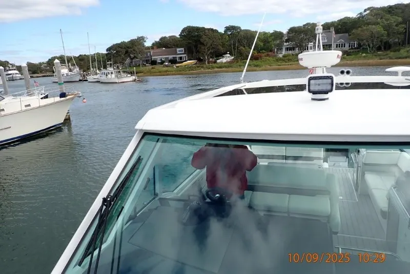 Slide: The Image of 2022 Formula 380 Super Sport Crossover OB interior with white seating and cup holders. - 24