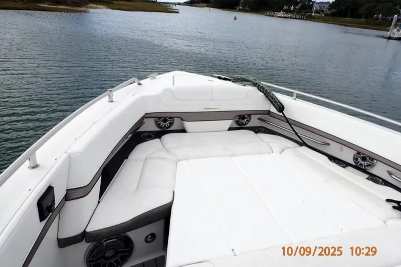 Slide: The Image of Open storage compartment in 2022 Formula 380 Super Sport Crossover OB boat. - 26