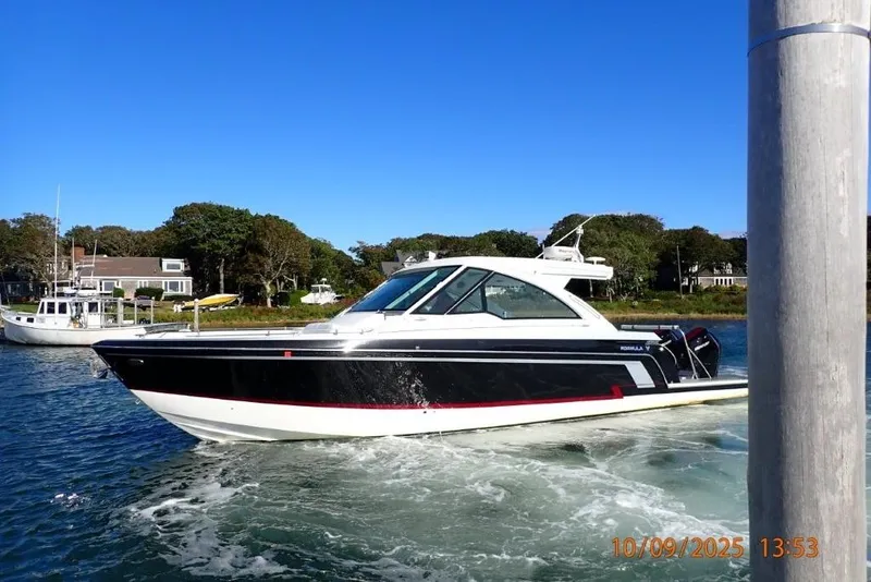 Slide: The Image of 2022 Formula 380 Super Sport Crossover OB boat cruising on a sunny day. - 3