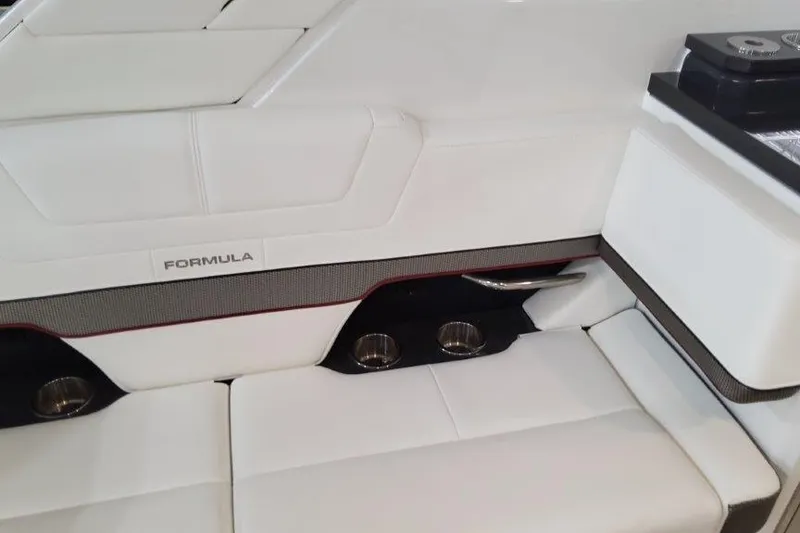 Slide: The Image of 2022 Formula 380 Super Sport Crossover OB interior with white leather seating and cup holders. - 38