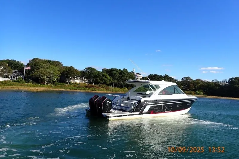 Slide: The Image of 2022 Formula 380 Super Sport Crossover OB cruising on a sunny day. - 4