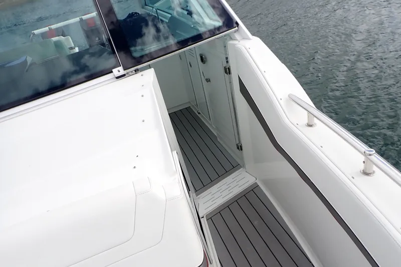 Slide: The Image of 2022 Formula 380 Super Sport Crossover OB boat deck with sleek design and water view. - 45