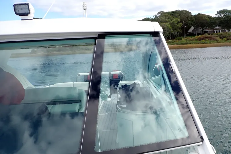 Slide: The Image of 2022 Formula 380 Super Sport Crossover OB on water, showcasing sleek design and spacious interior. - 46