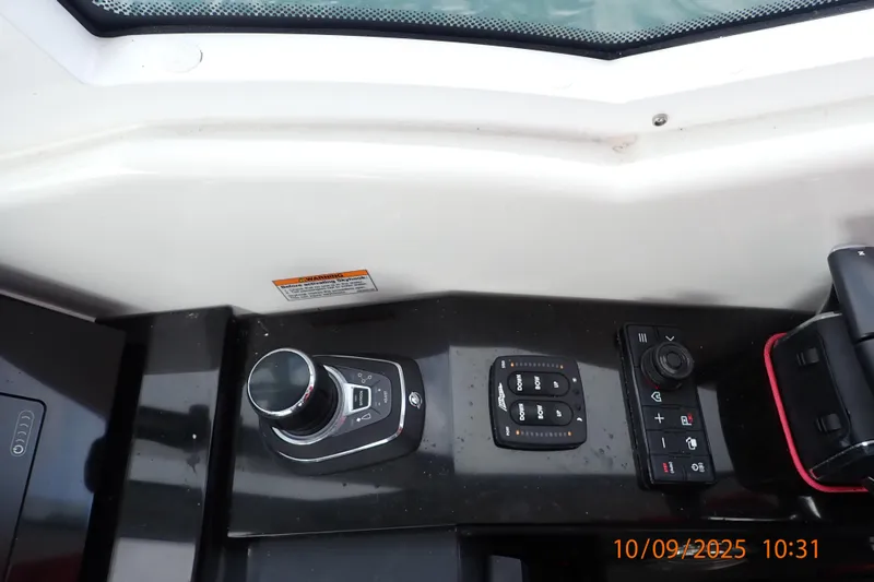 Slide: The Image of Control panel of 2022 Formula 380 Super Sport Crossover OB boat cockpit. - 49