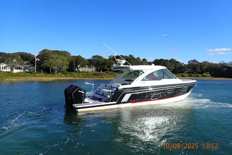 Slide: The Image of 2022 Formula 380 Super Sport Crossover OB cruising on a sunny day. - 5