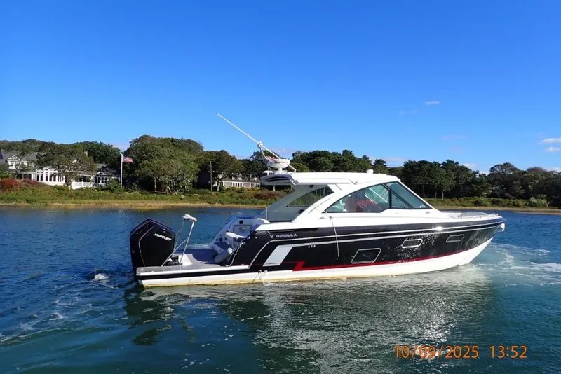 Slide: The Image of 2022 Formula 380 Super Sport Crossover OB boat cruising on a sunny day. - 6