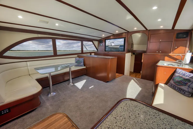 Slide: The Image of Luxurious interior of 2002 Paul Mann 60 Custom Carolina yacht with elegant seating and panoramic windows. - 10