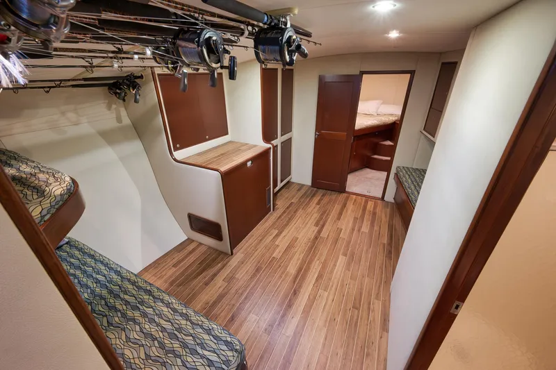 Slide: The Image of Interior of 2002 Paul Mann 60 Custom Carolina yacht with wooden flooring and bunk beds. - 15