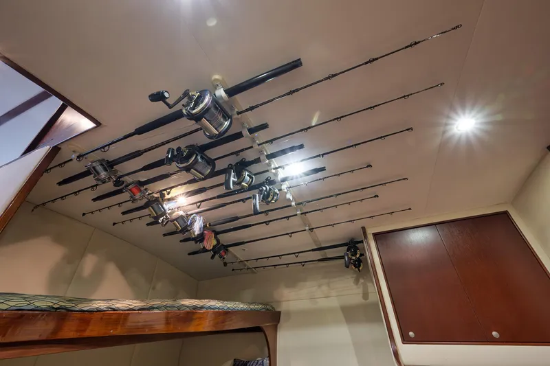 Slide: The Image of Fishing rods stored on ceiling of 2002 Paul Mann 60 Custom Carolina boat cabin. - 16