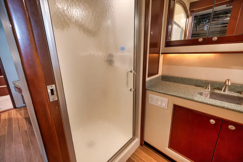 Slide: The Image of Luxurious bathroom interior of 2002 Paul Mann 60 Custom Carolina yacht with shower and sink. - 23