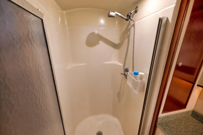 Slide: The Image of Shower area in 2002 Paul Mann 60 Custom Carolina yacht, featuring modern fixtures. - 24