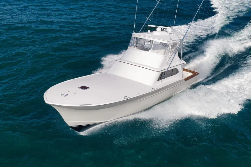 Slide: The Image of 2002 Paul Mann 60 Custom Carolina yacht cruising on open ocean waters. - 28