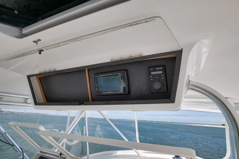 Slide: The Image of Control panel on 2002 Paul Mann 60 Custom Carolina boat, featuring FLIR system. - 32