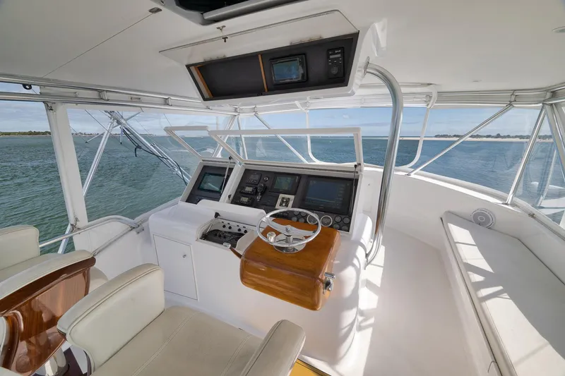 Slide: The Image of Helm of 2002 Paul Mann 60 Custom Carolina yacht with navigation equipment and ocean view. - 33