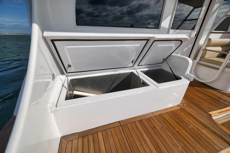 Slide: The Image of Open storage compartments on 2002 Paul Mann 60 Custom Carolina yacht deck. - 46