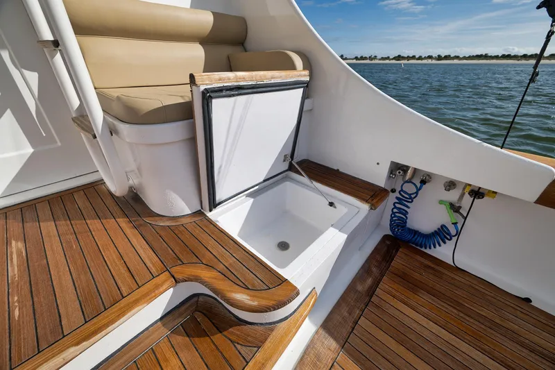 Slide: The Image of Luxurious 2002 Paul Mann 60 Custom Carolina yacht deck with seating and storage. - 51