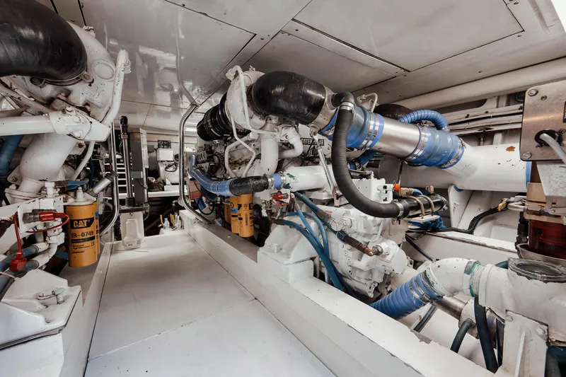 Slide: The Image of Engine room of 2002 Paul Mann 60 Custom Carolina yacht, showcasing machinery and components. - 58