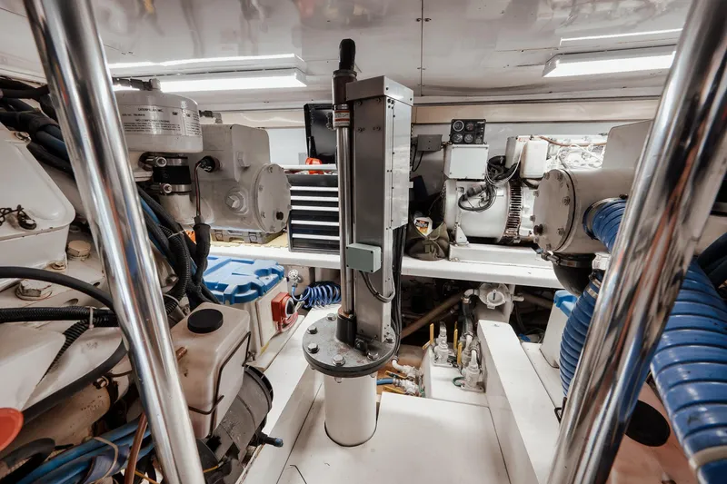 Slide: The Image of Engine room of 2002 Paul Mann 60 Custom Carolina yacht, showcasing mechanical components and equipment. - 61