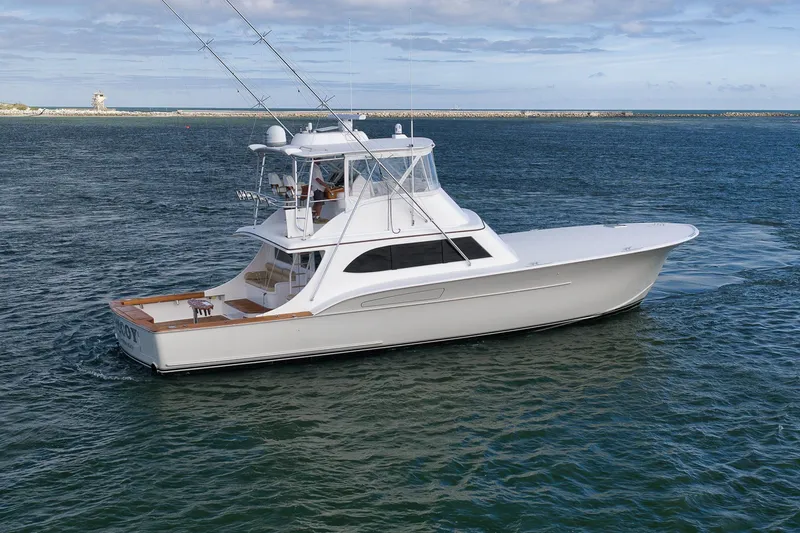 Slide: The Image of 2002 Paul Mann 60 Custom Carolina yacht cruising on open water. - 73