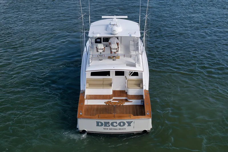 Slide: The Image of Paul Mann 60 Custom Carolina 2002 yacht on water, rear view, named "Decoy." - 77