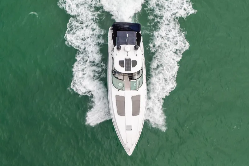 Slide: The Image of Overhead view of 2005 Formula 48 Yacht cruising on green water. - 15