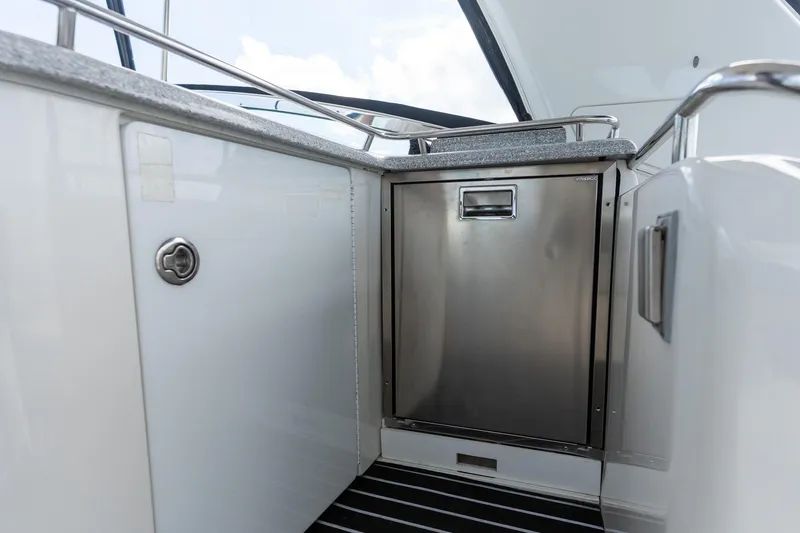 Slide: The Image of 2005 Formula 48 Yacht interior with stainless steel cabinet and sleek design. - 19