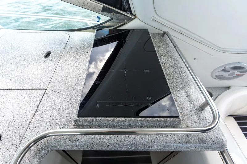 Slide: The Image of Granite countertop with sleek black cooktop on 2005 Formula 48 Yacht. - 21