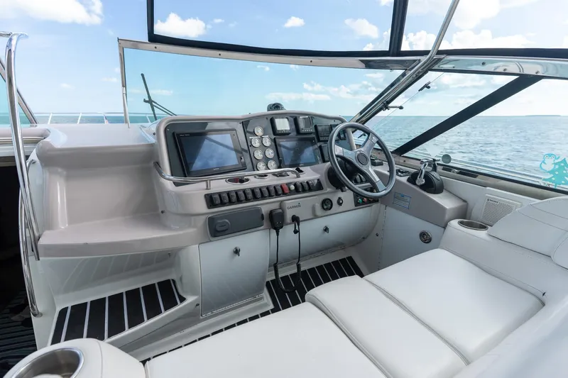 Slide: The Image of Cockpit of 2005 Formula 48 Yacht with steering wheel and navigation equipment. - 22