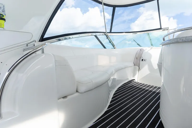 Slide: The Image of Luxurious interior of 2005 Formula 48 Yacht with white seating and panoramic windows. - 29