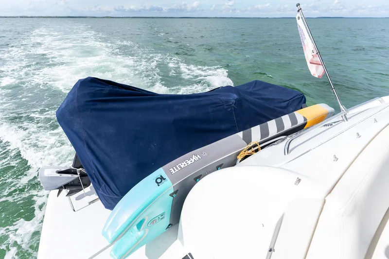 Slide: The Image of 2005 Formula 48 Yacht cruising with paddleboard on deck, ocean view. - 33