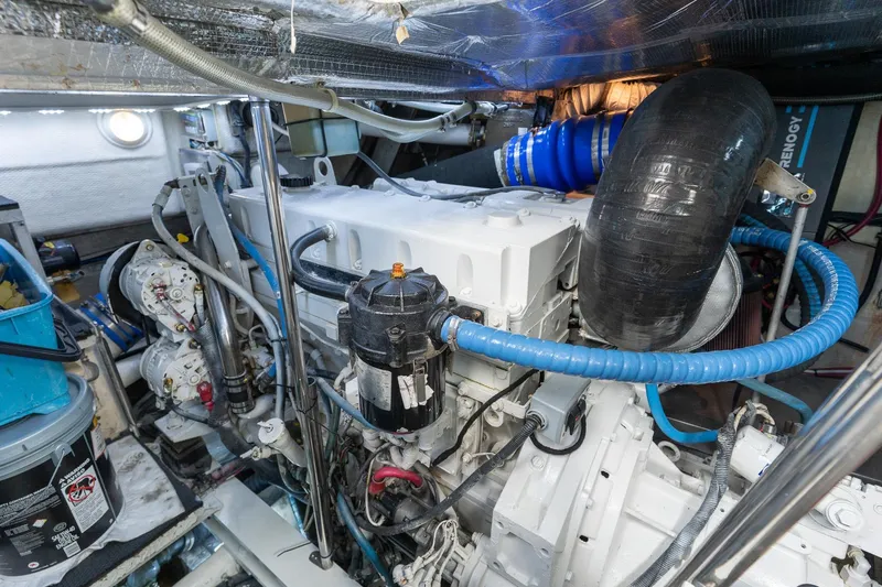Slide: The Image of Engine room of a 2005 Formula 48 Yacht, showcasing mechanical components and systems. - 36